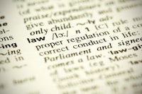 a close up of the word law in a dictionary