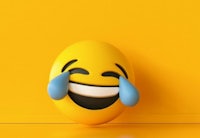 an emoji face on a yellow background
